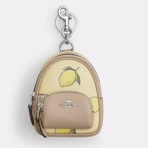 COACH Mini Court Backpack Bag Charm With
Lemon Print In Canvas Yellow CAPO3